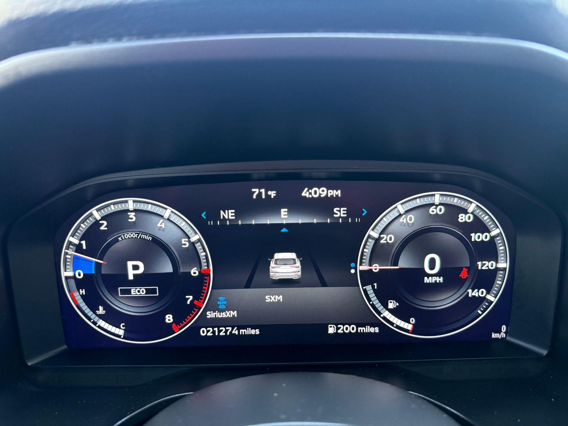 Dashboard display showing vehicle speed, fuel level, and other driving information.