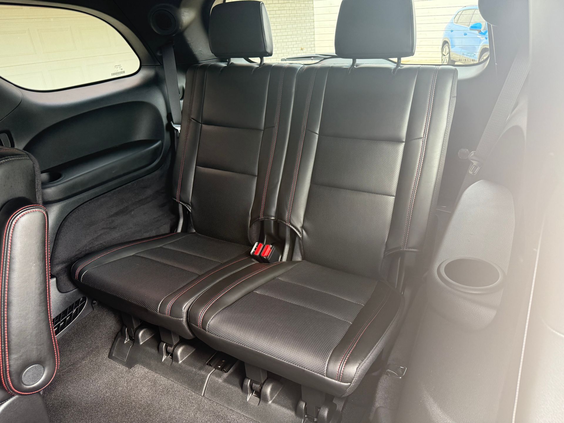 Black leather SUV back row seats.