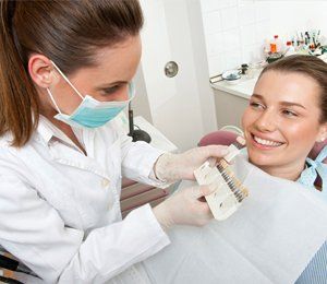 Dentist showing a women her denture options