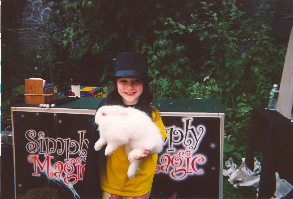 Kid with a white rabbit