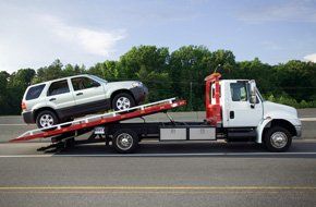Truck towing a car