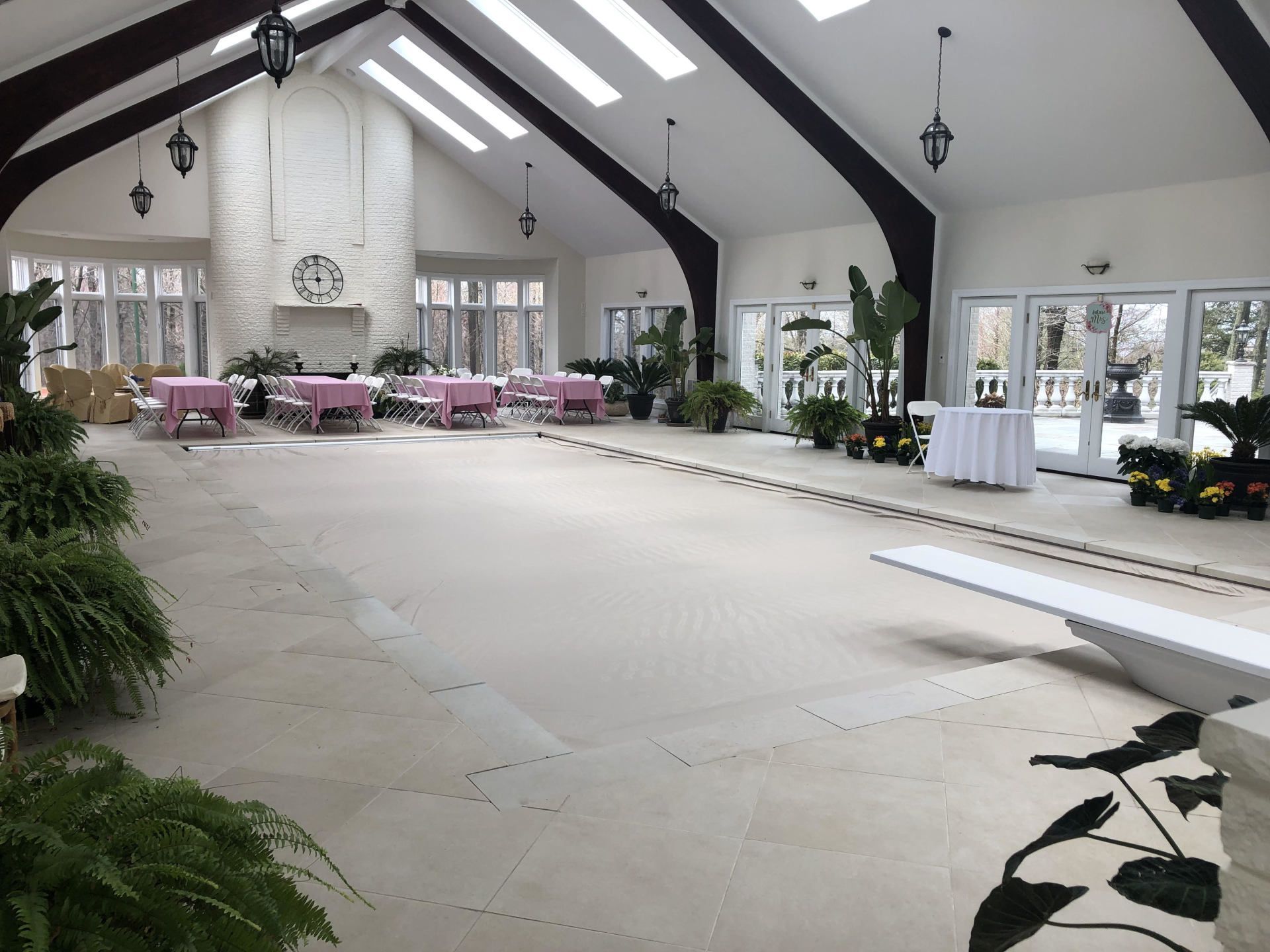 A large room with tables and chairs in it