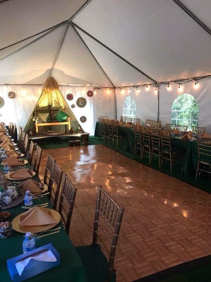 a tent with tables and chairs