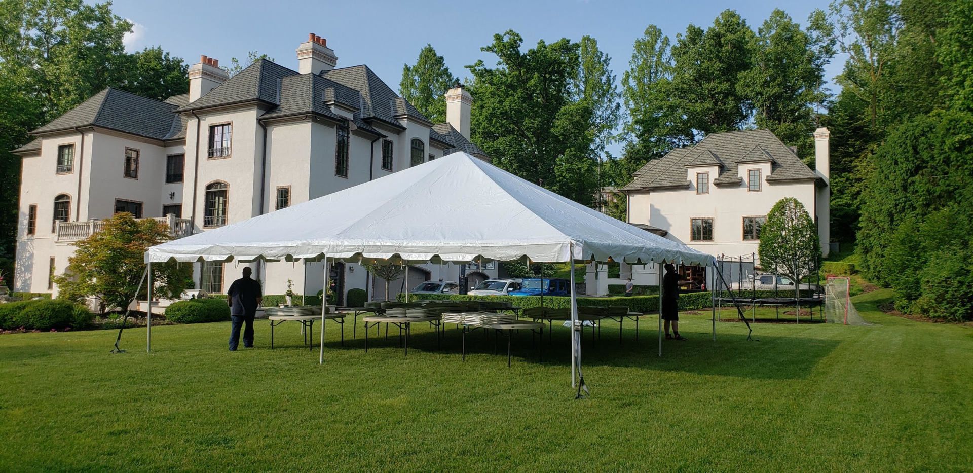 a white tent in a yard