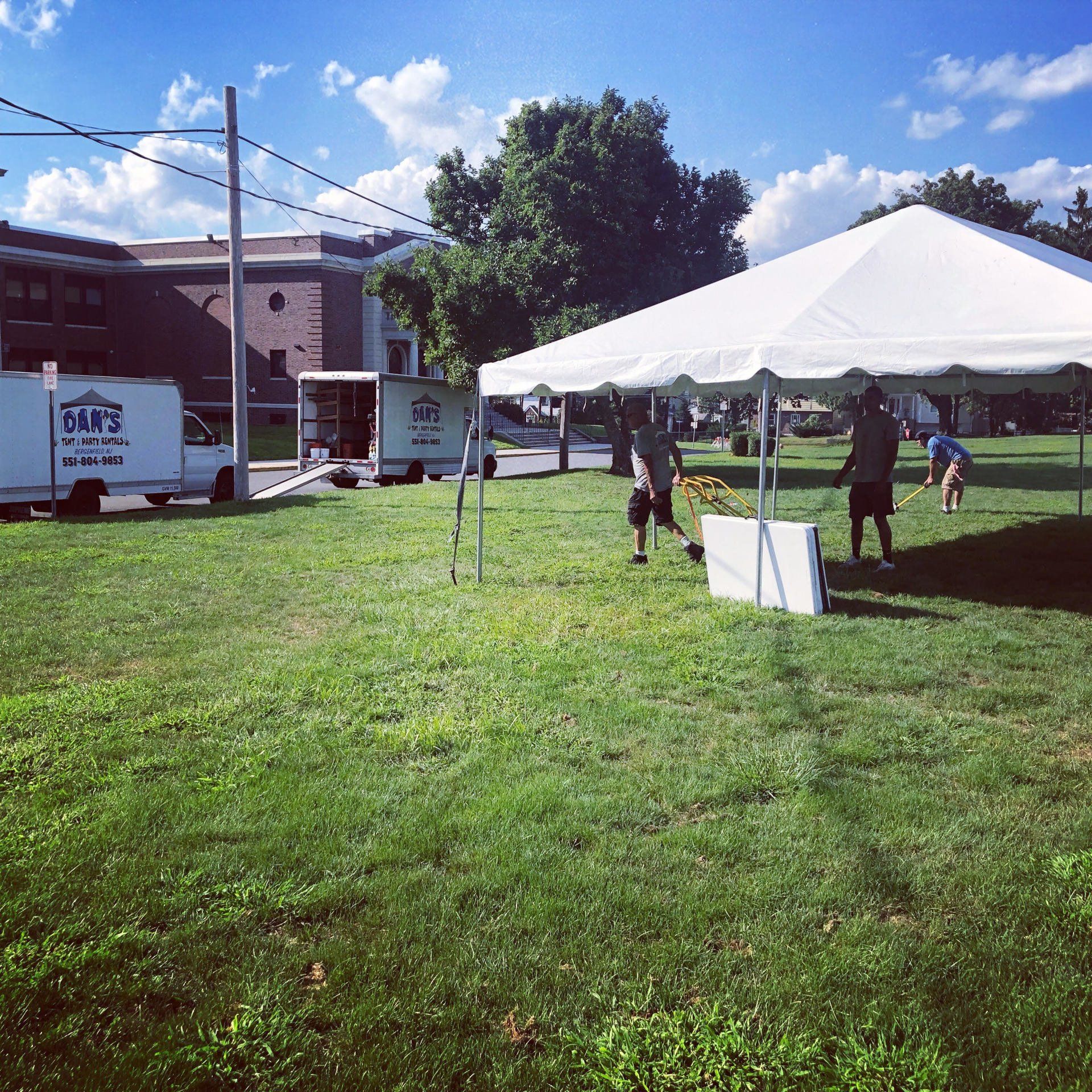 a group of people under a white tent