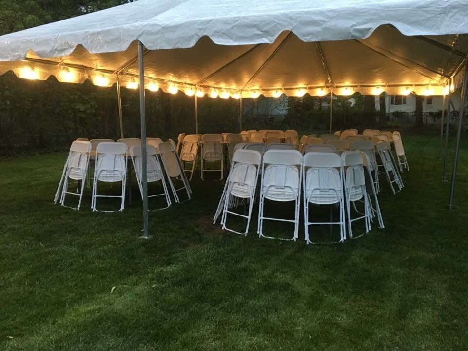 a group of chairs under a tent