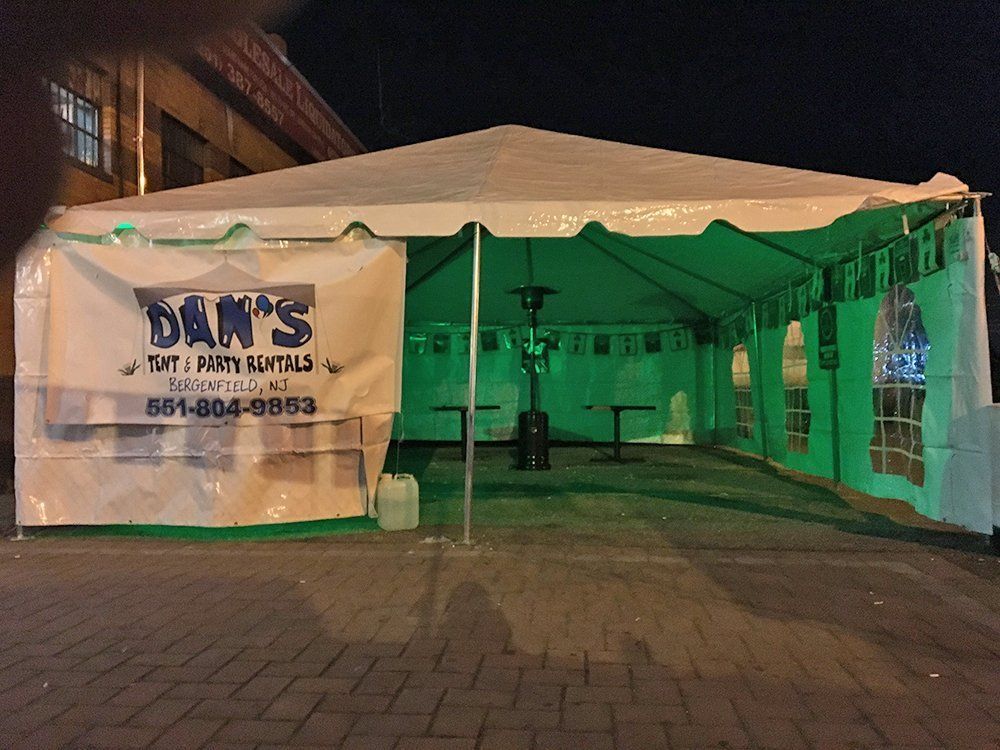 a green light tent with a sign on it