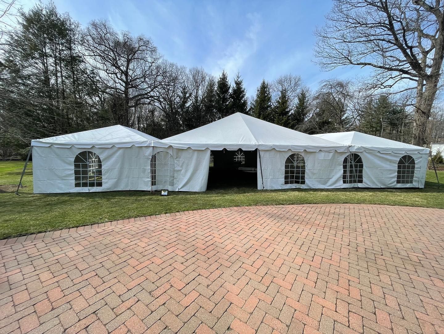 a white tent with persony windows