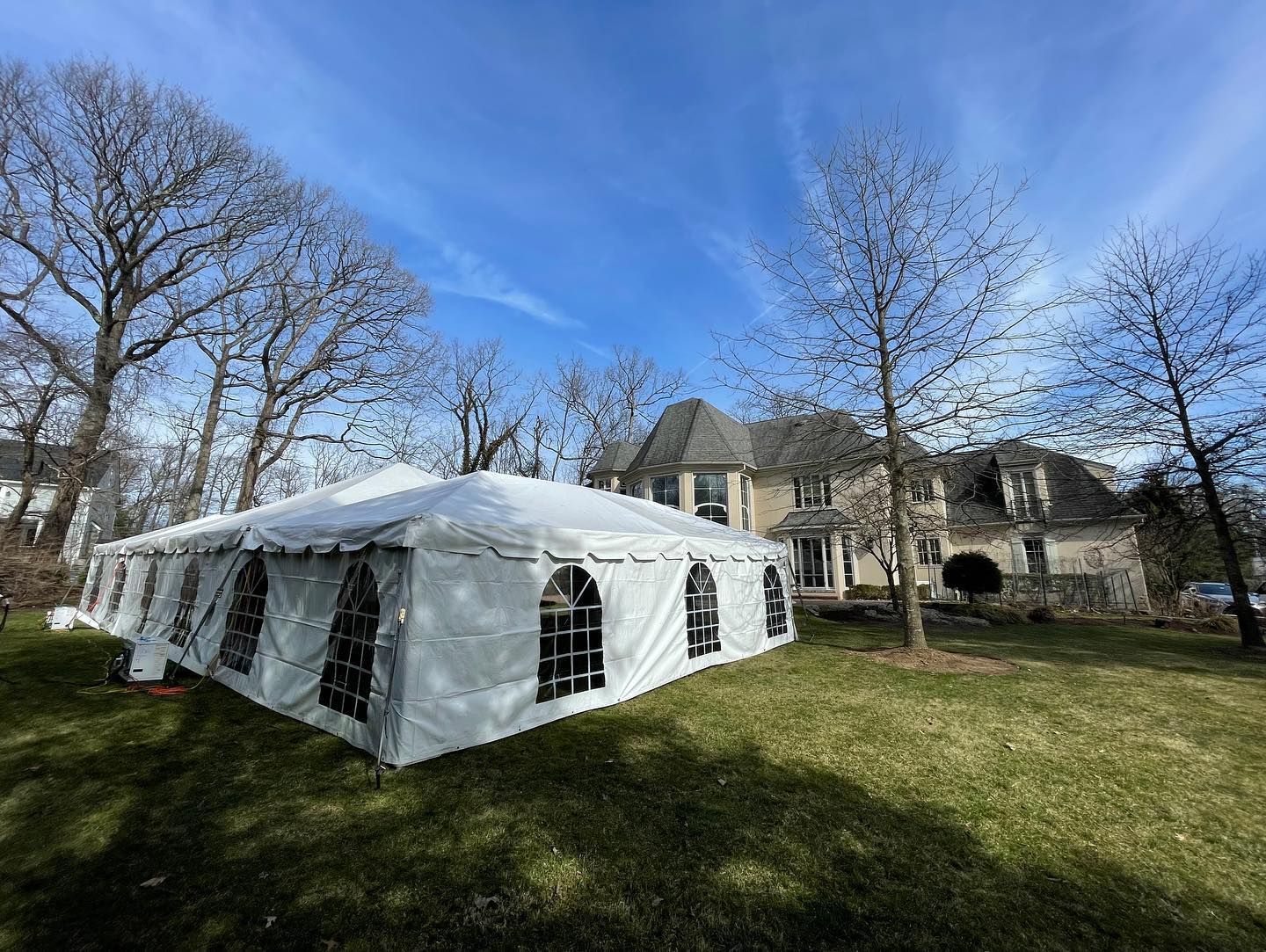 a white tent in a yard