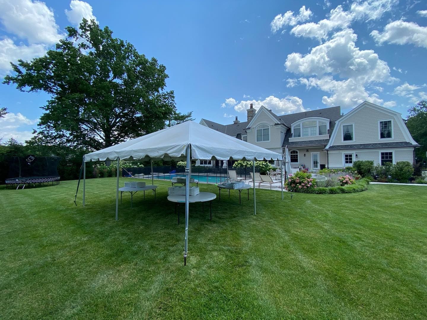 a white tent in a yard