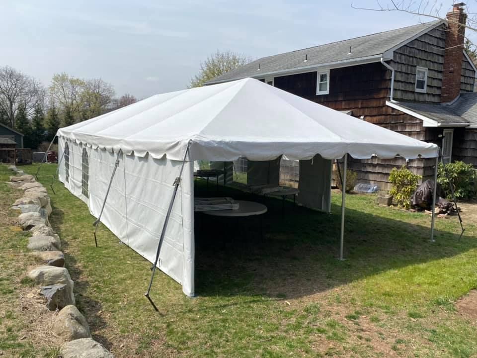 a white tent in a yard