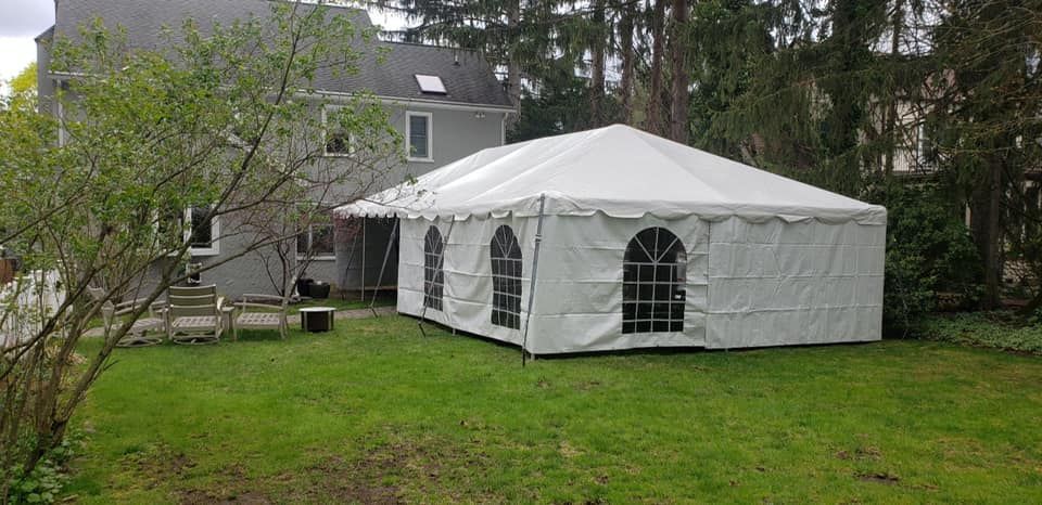 a white tent in a yard #5