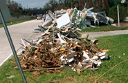 Trash piles along roadside
