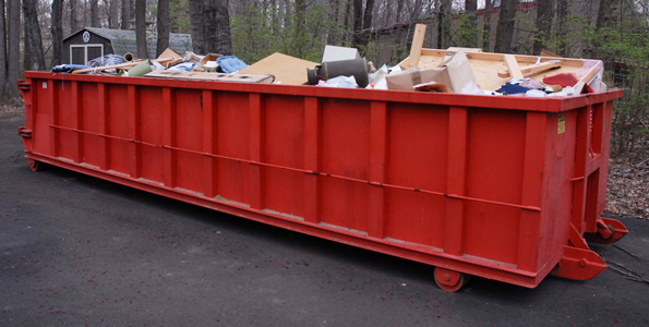 Roll-off dumpster full of debris