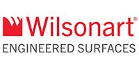 The wilsonart logo is red and white and says engineered surfaces.