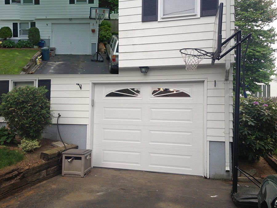 A garage door with a basketball hoop attached to it
