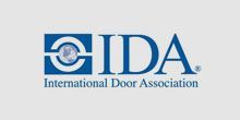 The logo for the international door association is blue and white.