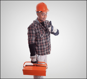 A portrait of a plumber with a toolbox