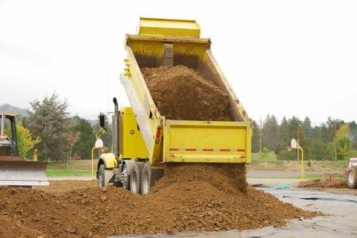 Truck dumping soil