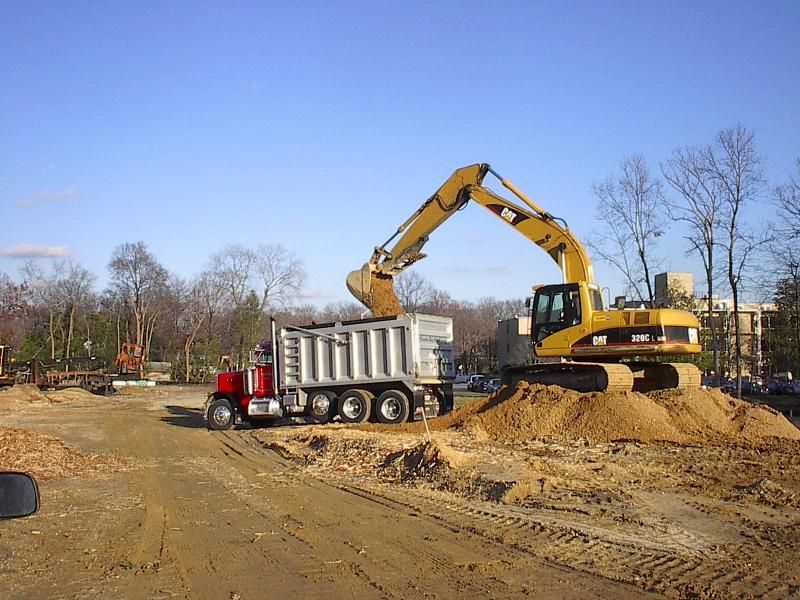 Dumptruck and backhoe