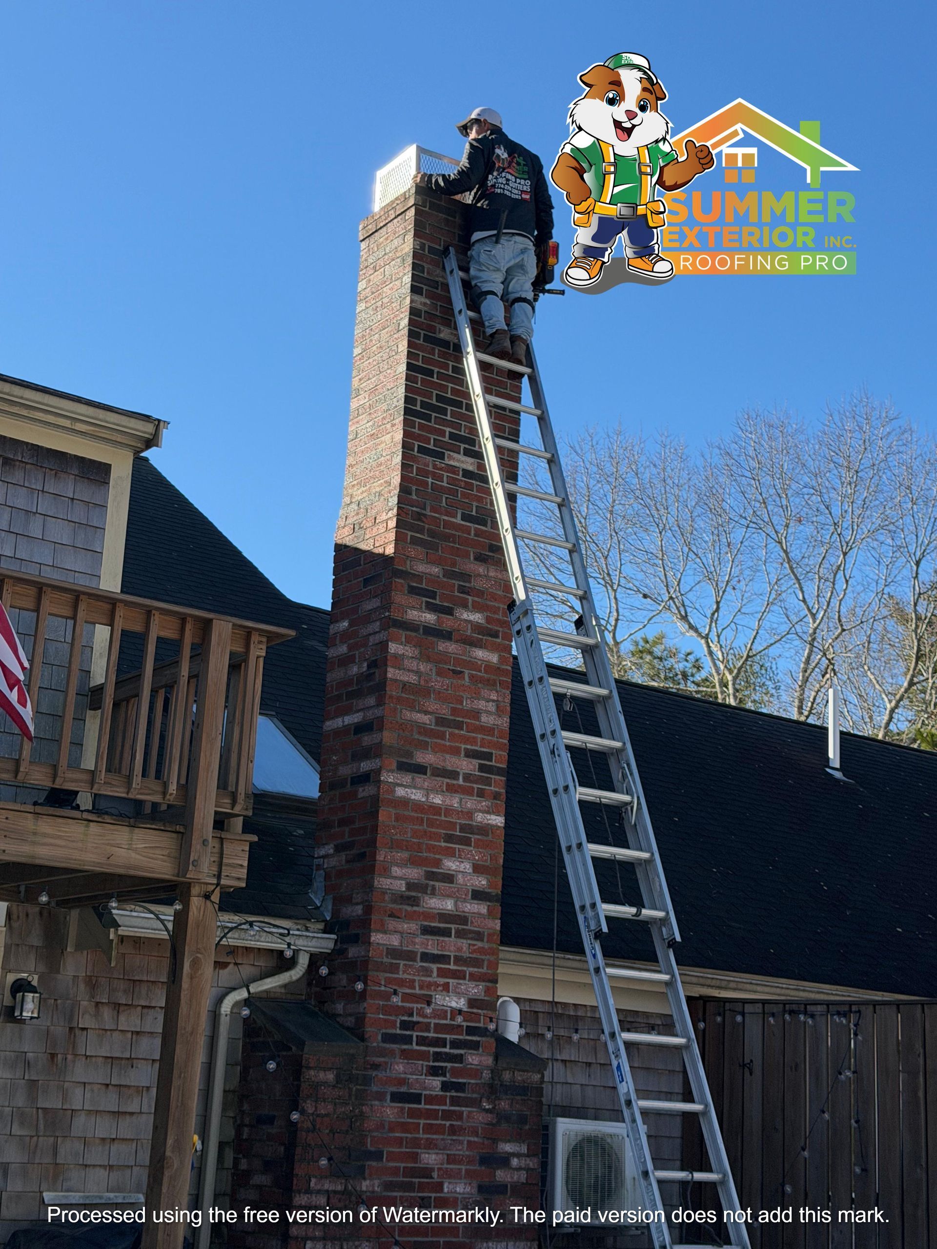 A worker on an extension ladder repairs a brick chimney, with a branded company mascot graphic in the top right.