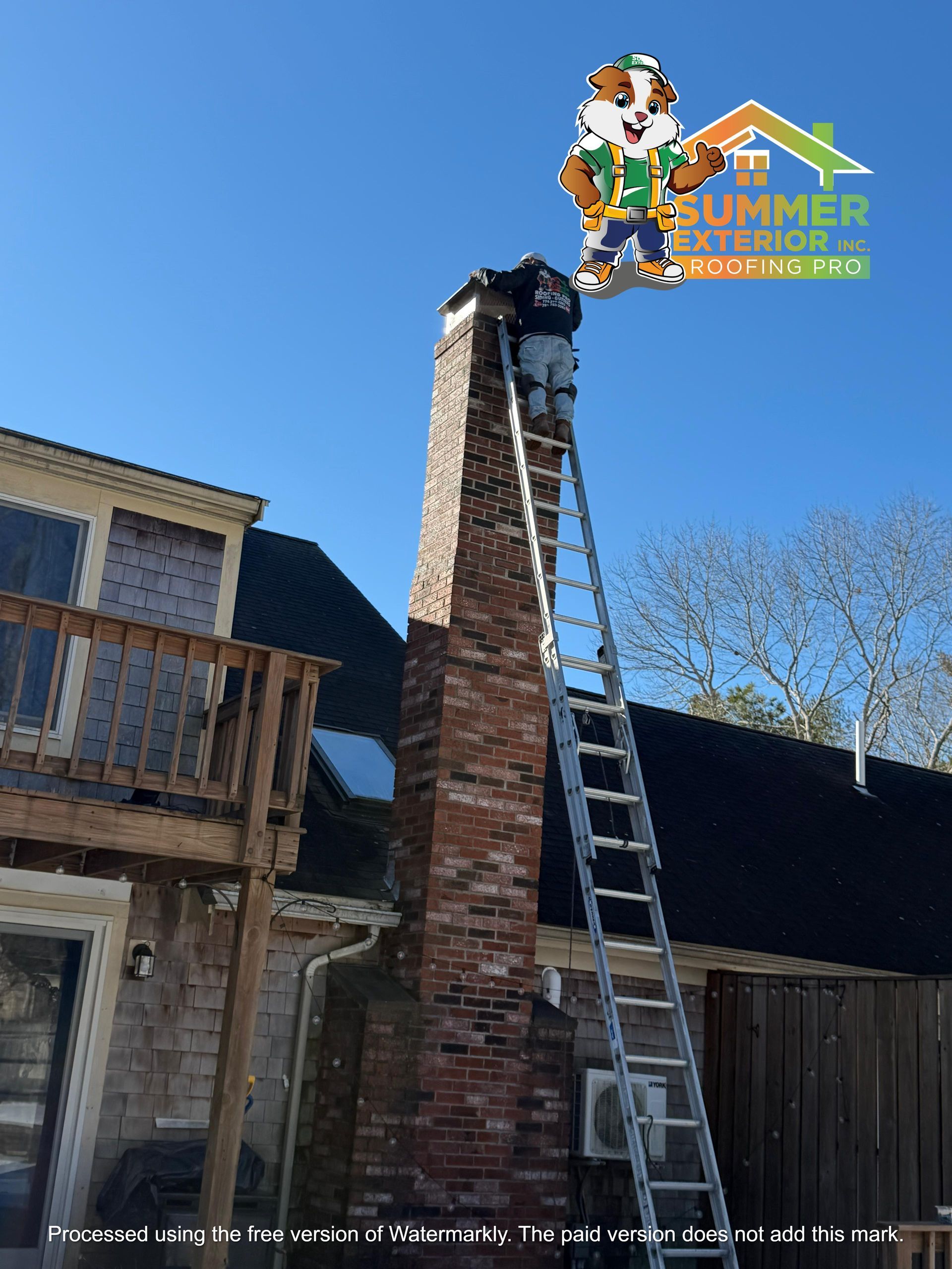 A worker on a tall ladder repairs a brick chimney on a sunny day, with a company mascot logo in the upper corner.