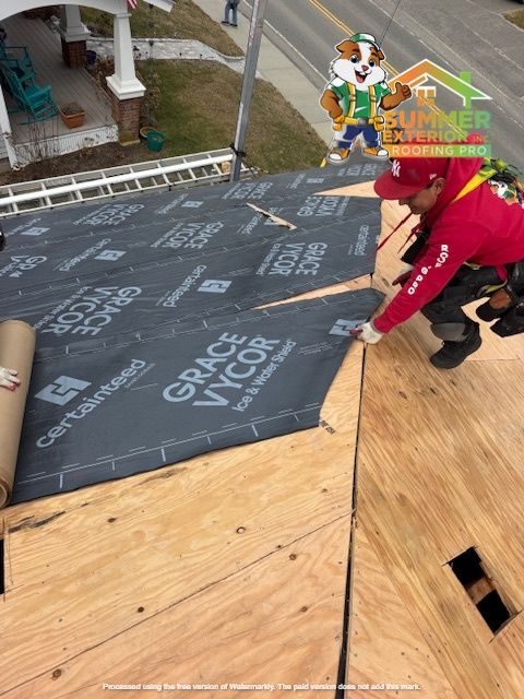 Roofer installing Grace Vycor underlayment on a wooden roof.