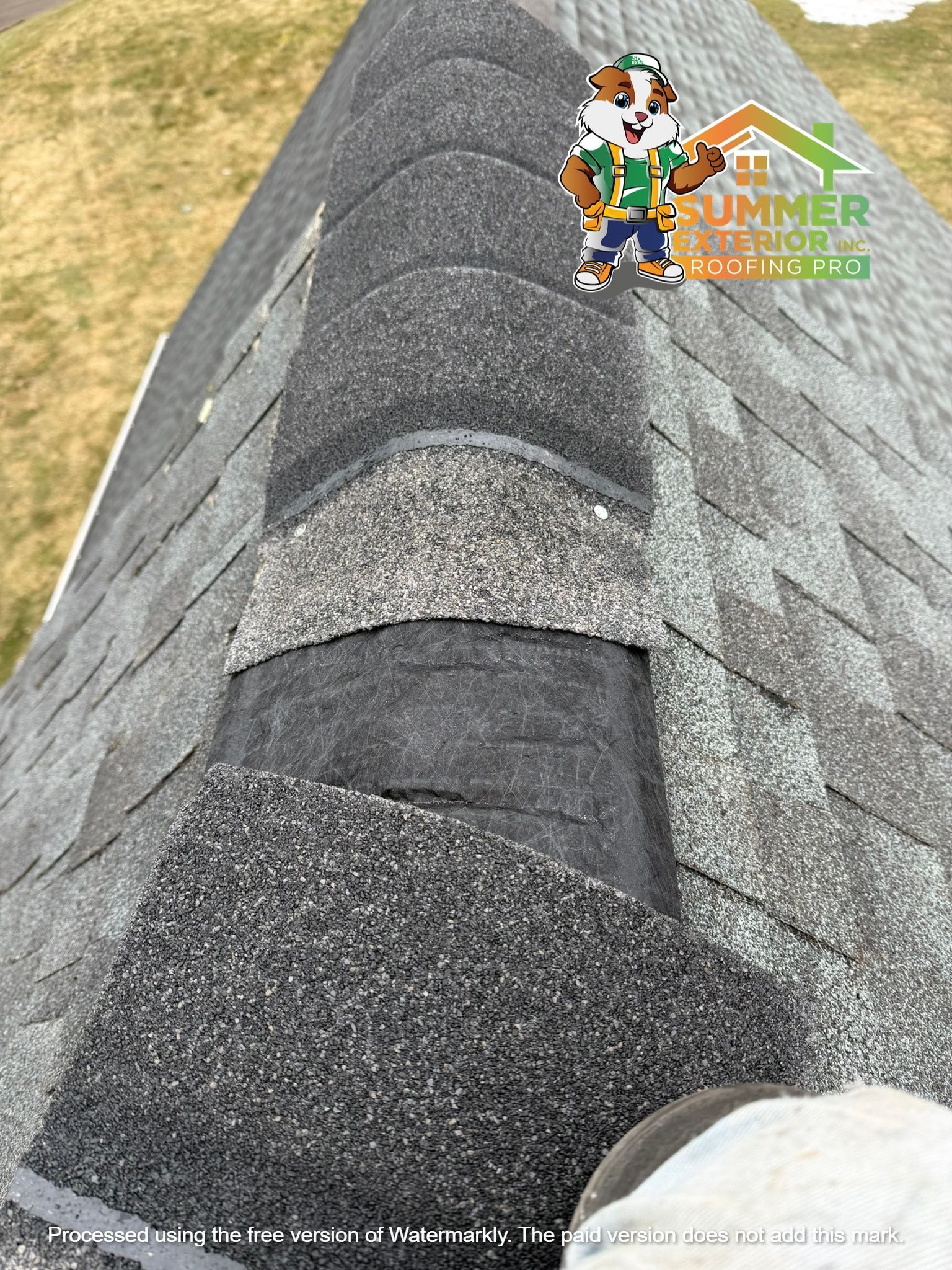 A damaged asphalt roof ridge with missing shingles, accompanied by a company logo overlay.