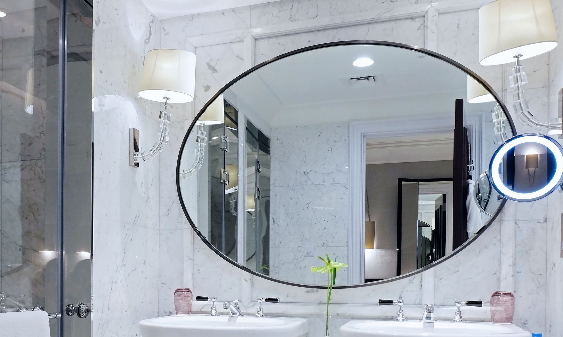a bathroom with two sinks and a large mirror .