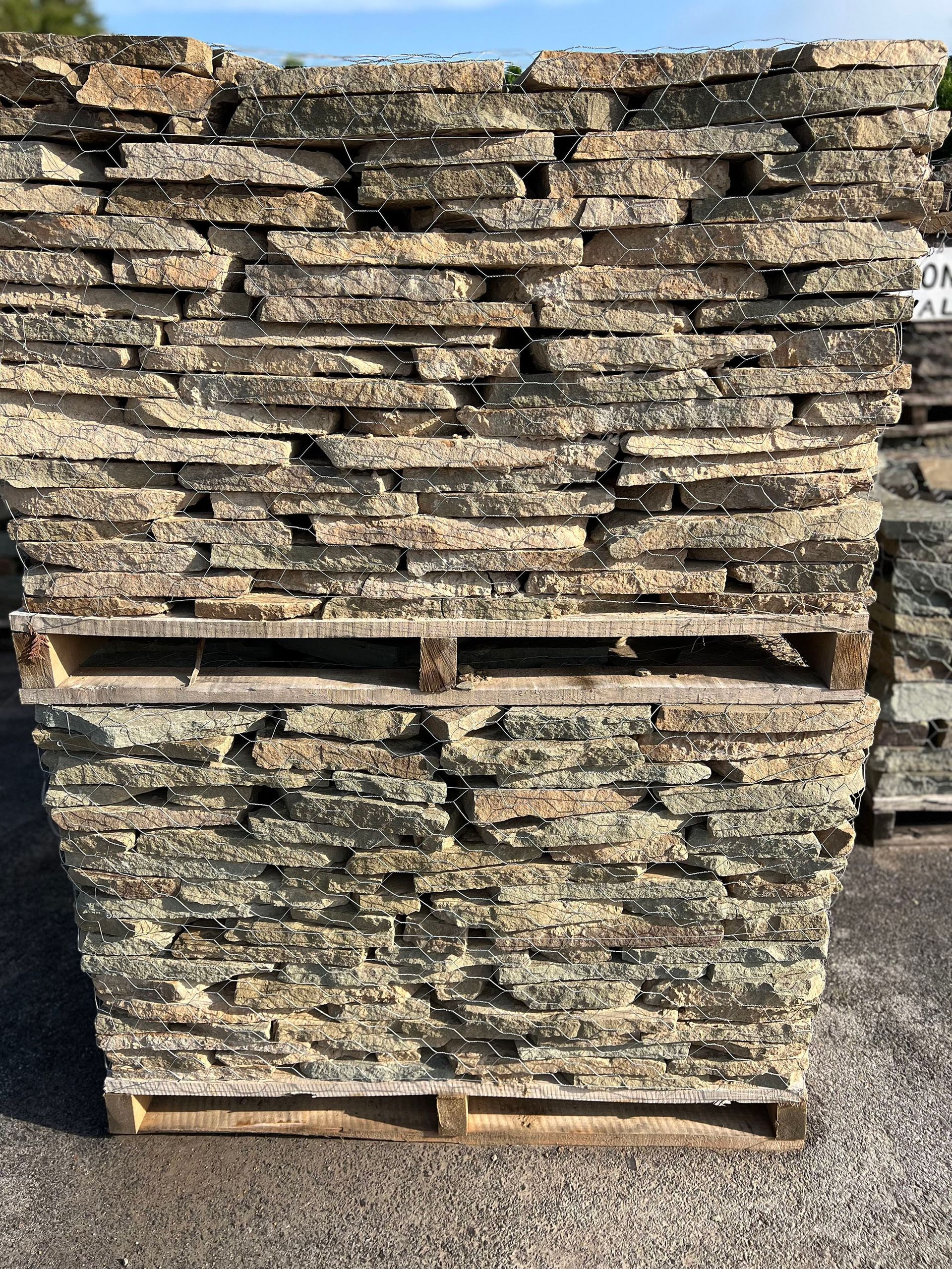 A pile of rocks stacked on top of each other on wooden pallets.