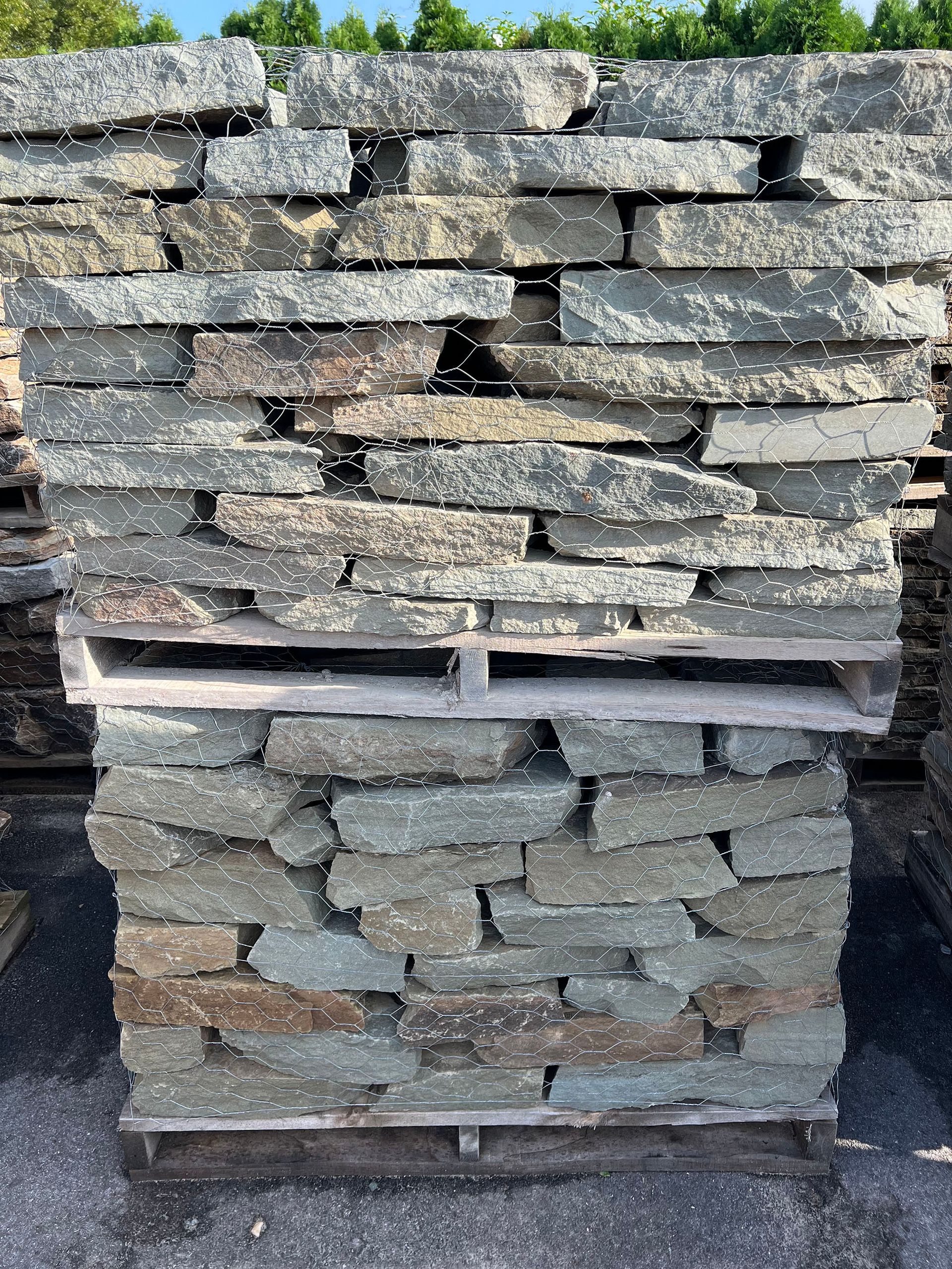 A pile of rocks stacked on top of each other on a wooden pallet