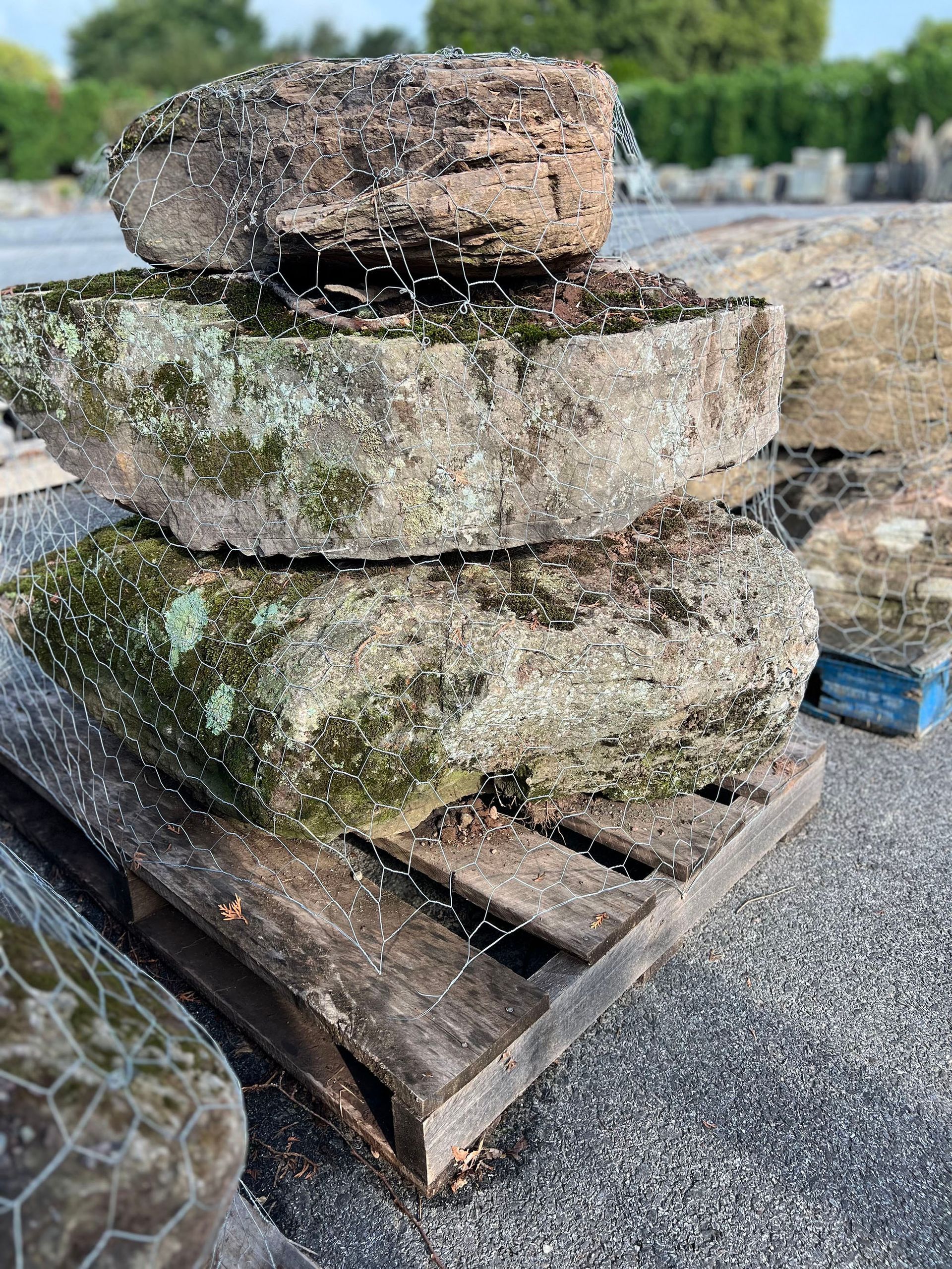 A pile of rocks stacked on top of each other on a wooden pallet.