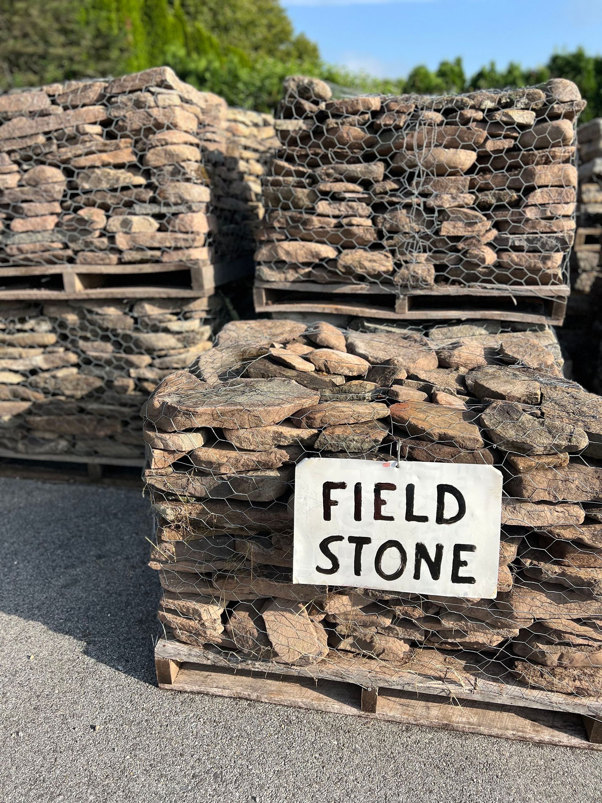 Pallets of field stone are stacked on top of each other