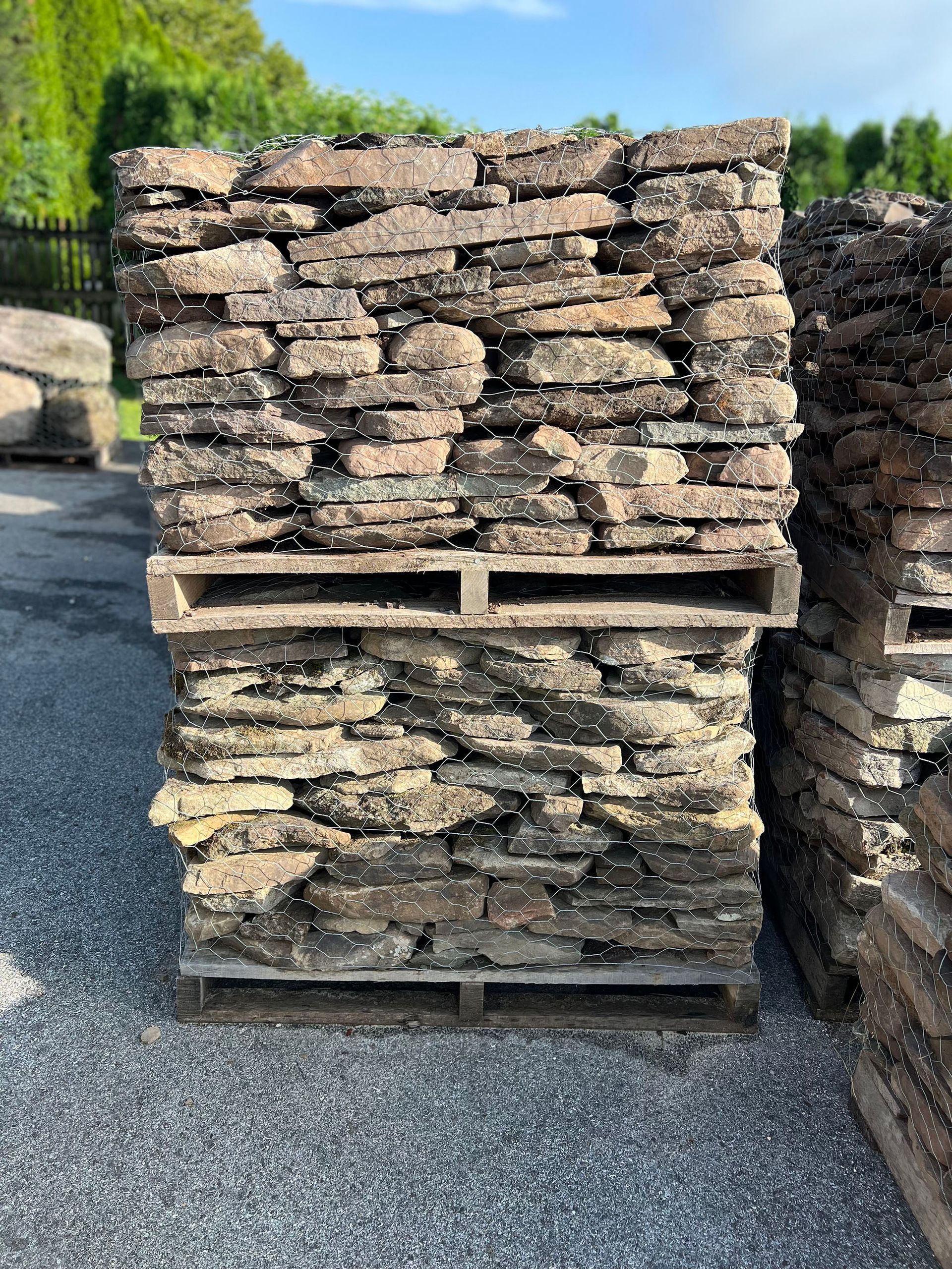 A pile of rocks stacked on top of each other on wooden pallets