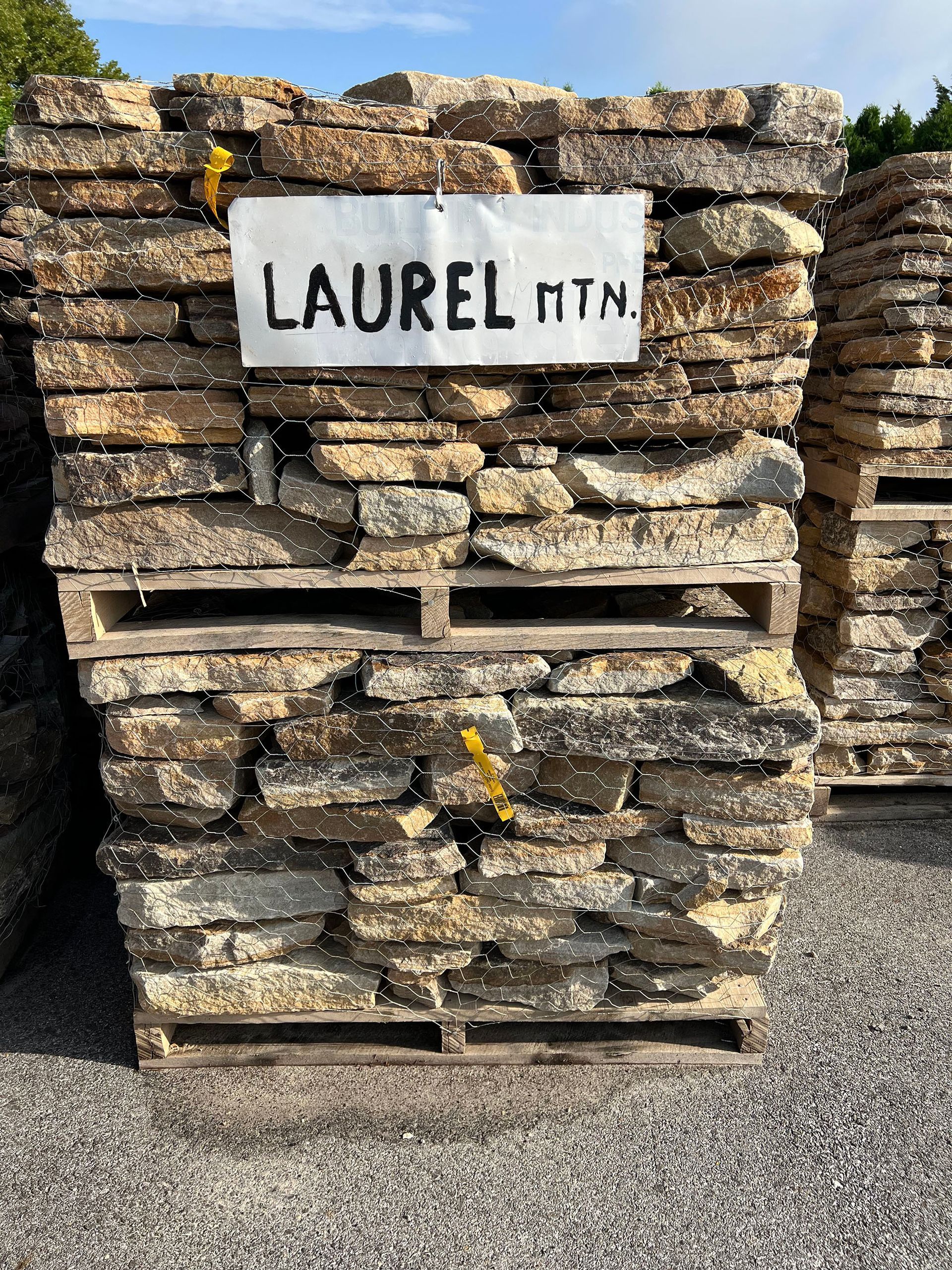 A pile of rocks with a sign that says laurel mtn