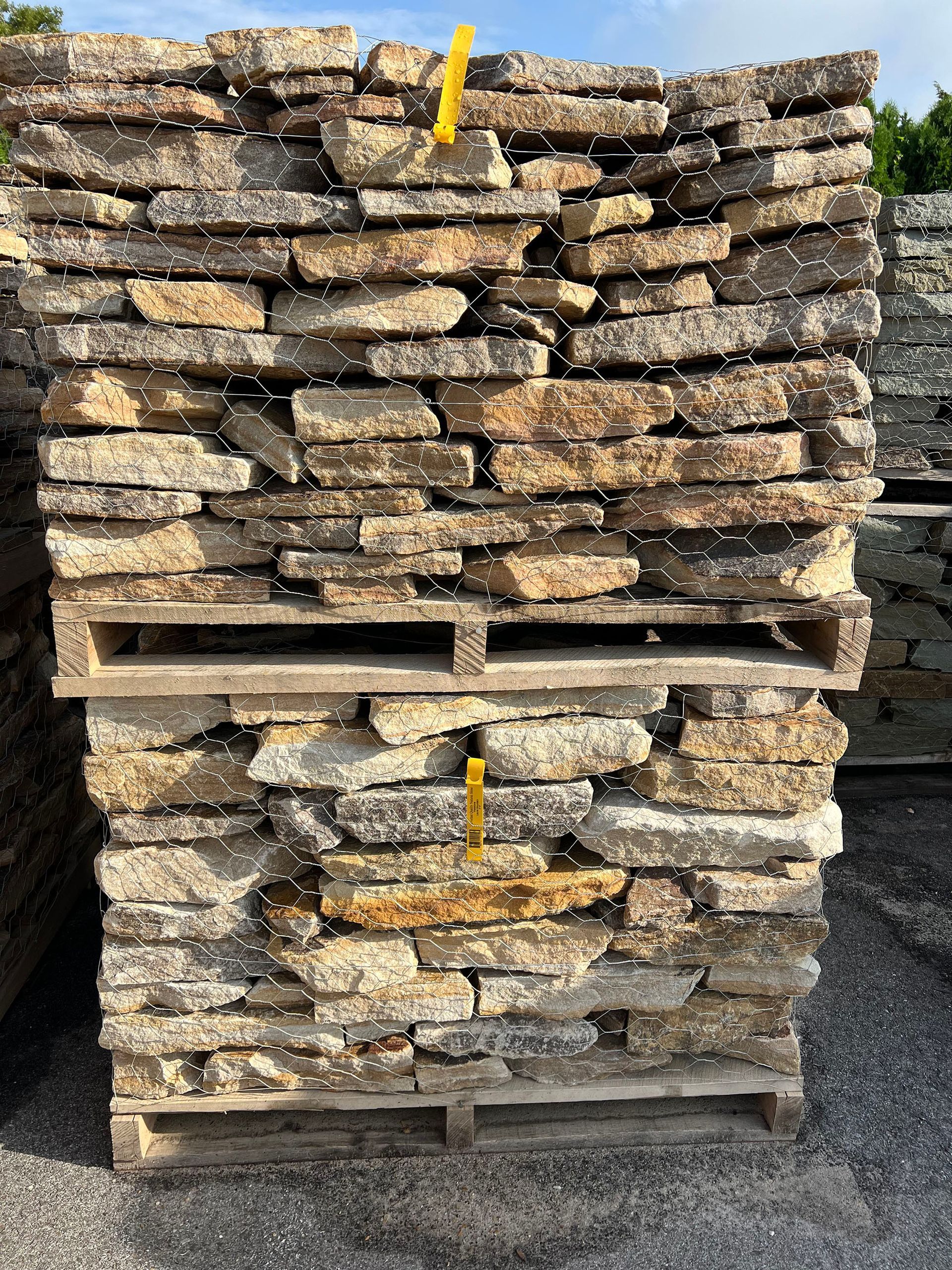 A pile of rocks stacked on top of each other on wooden pallets