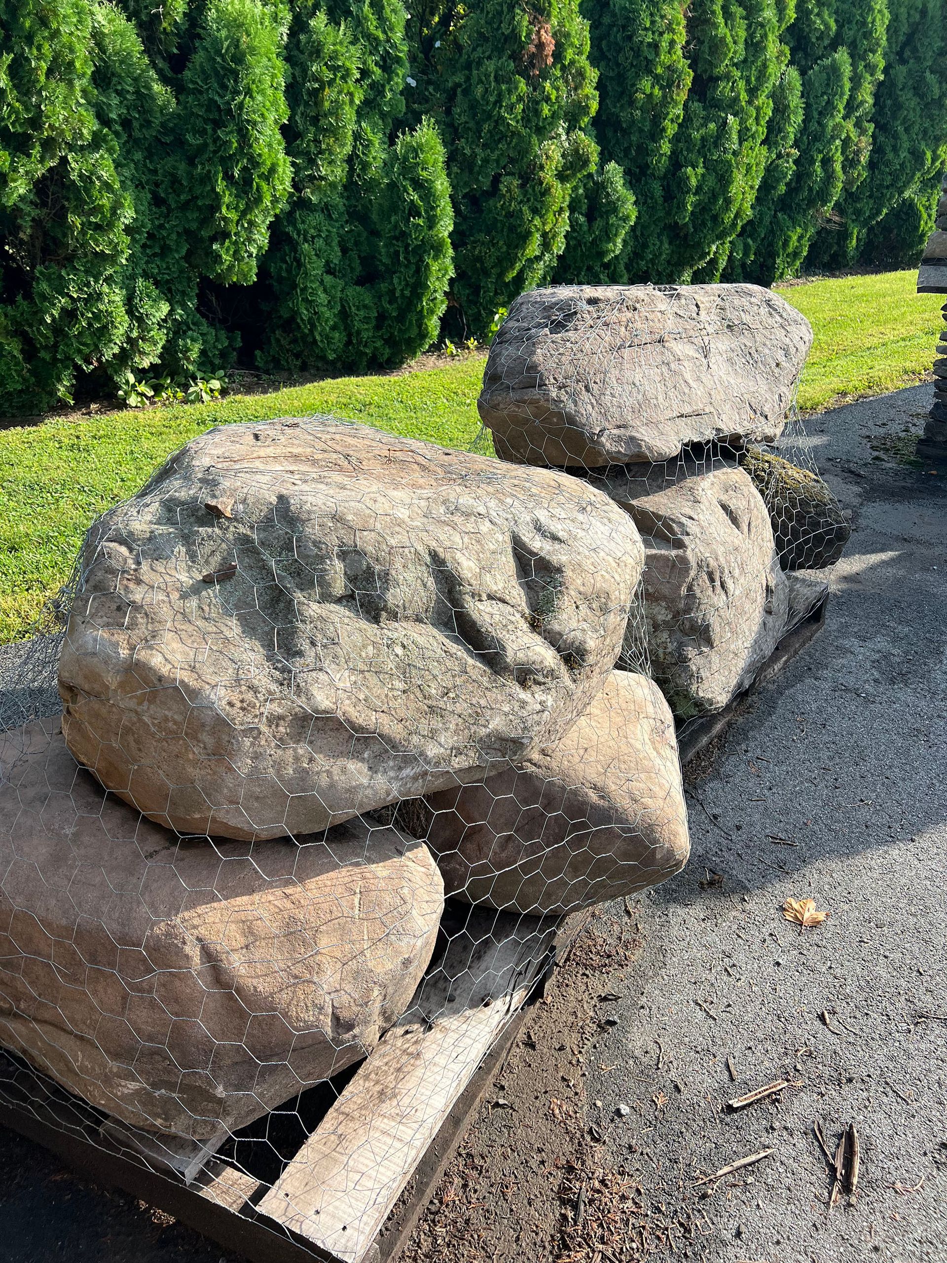 A pile of rocks sitting on top of a wooden pallet.