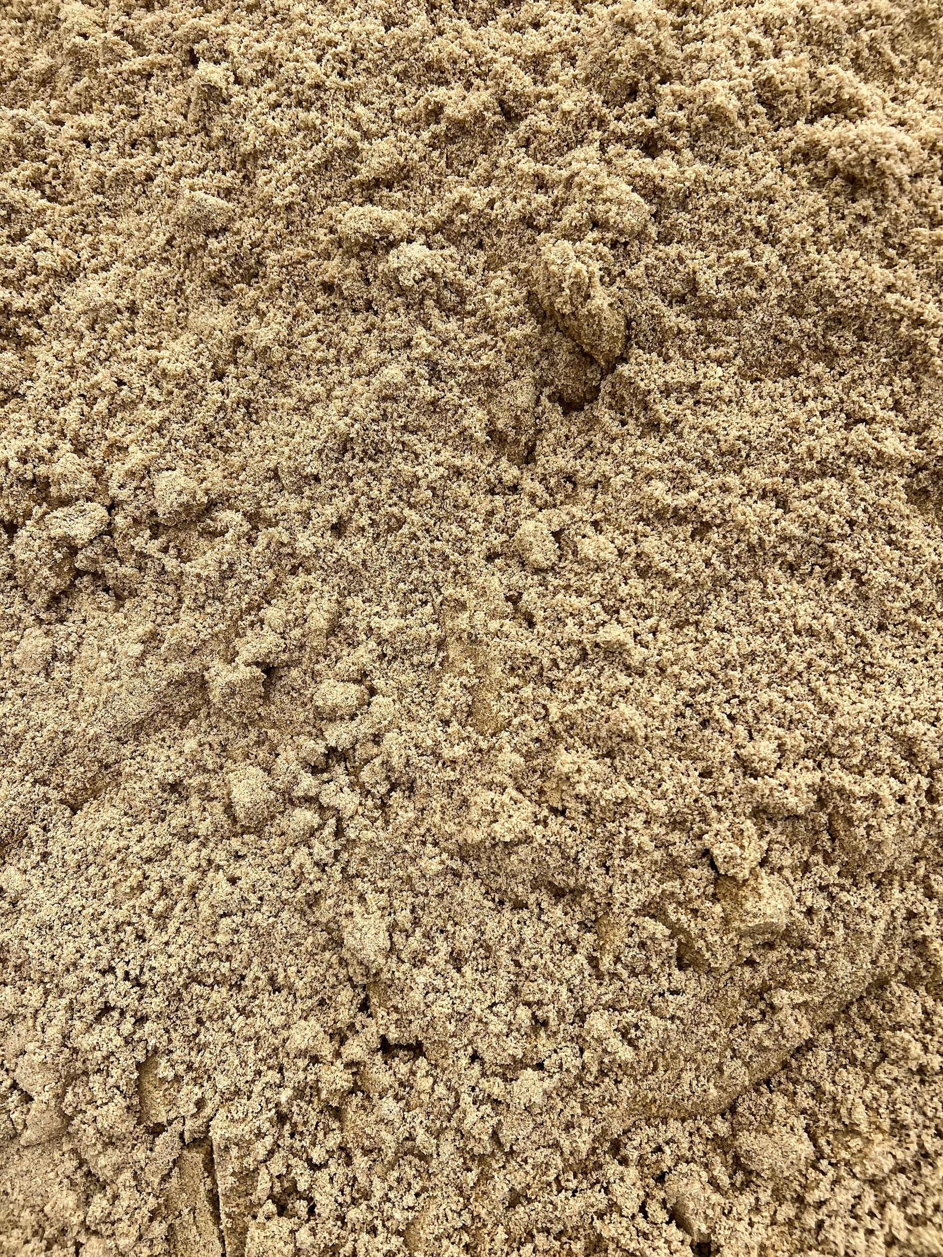 A close up of a pile of sand.