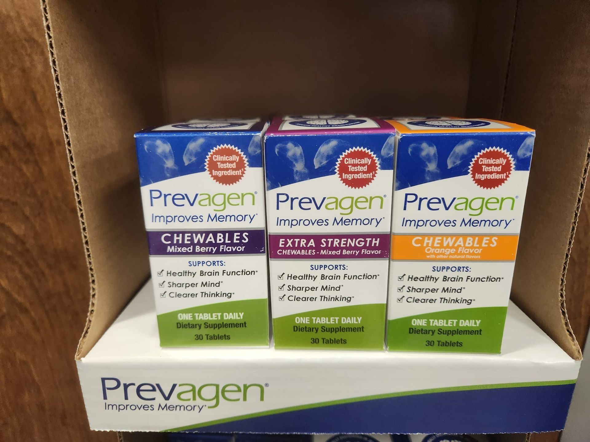 Three boxes of Prevagen memory supplements on a shelf.