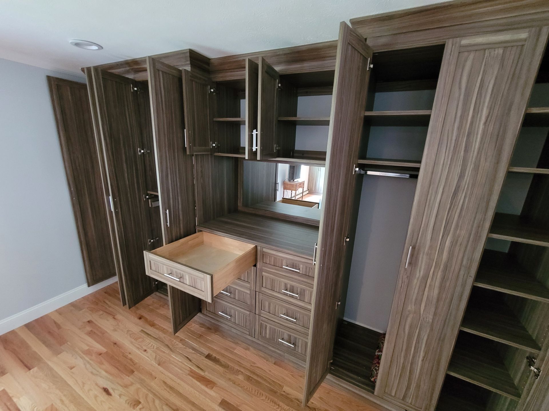 There is a drawer in the middle of the closet.