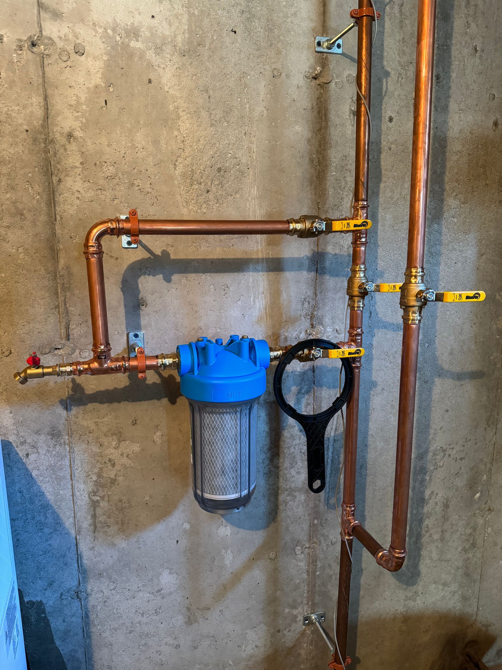 A copper pipe with a filter attached to it