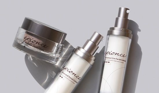 Three Epionce skincare products with silver caps against a light grey background.