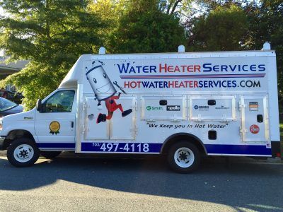 White Water Heater Services truck with company logo and contact info parked outdoors.