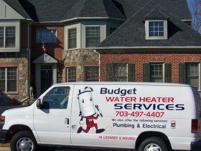 Budget Water Heater Services van parked in front of a house