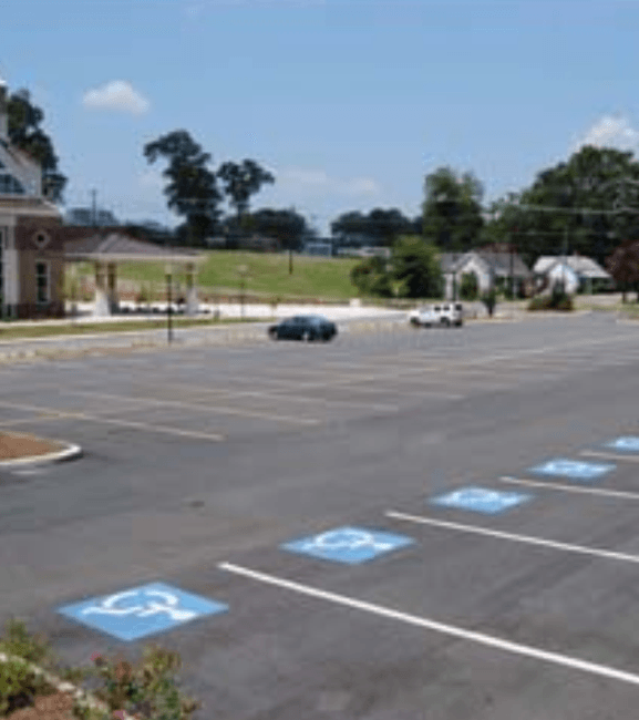 A parking lot with handicap signs painted on it