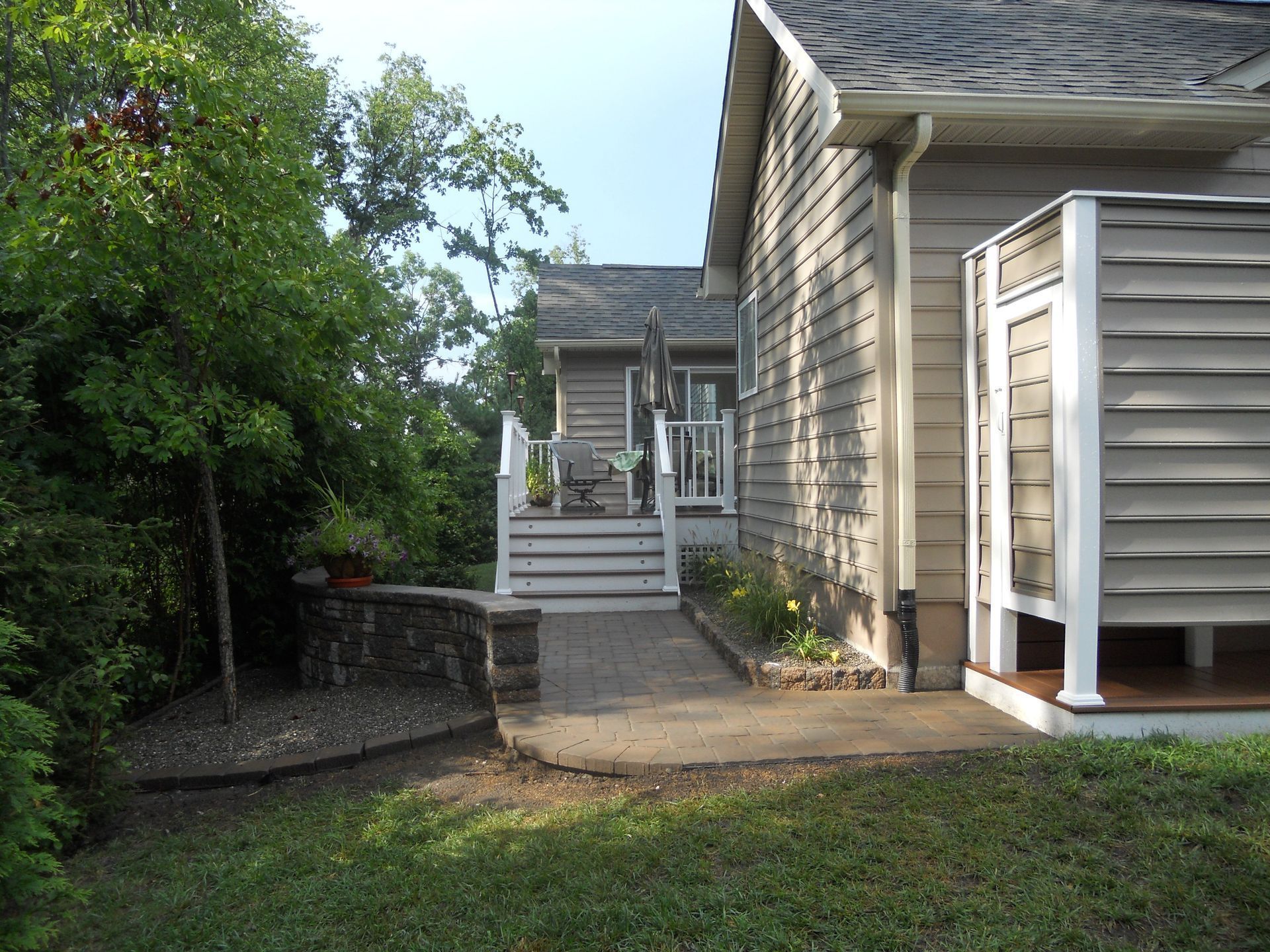 A house with a patio and stairs leading up to it