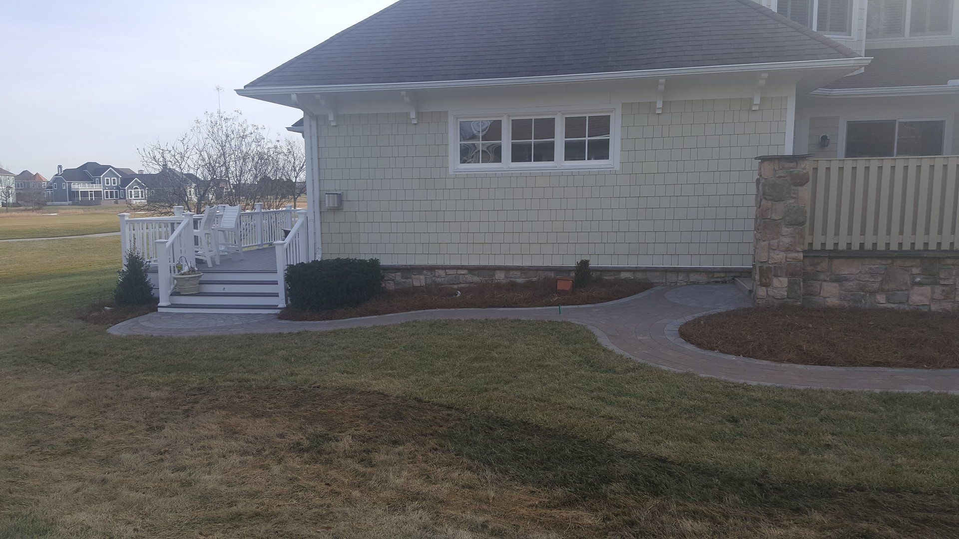 A white house with a walkway leading to it