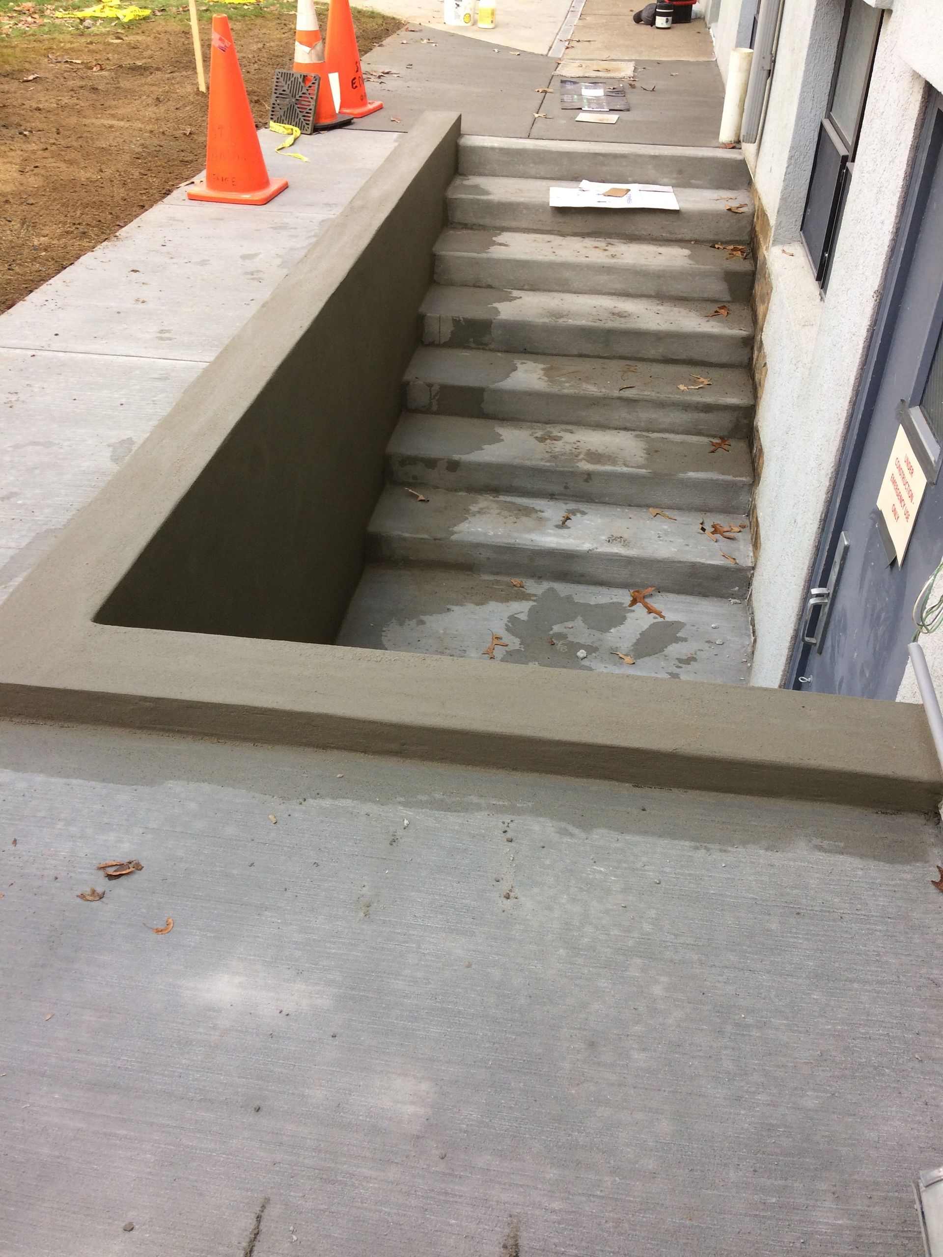 A set of concrete stairs leading up to a building
