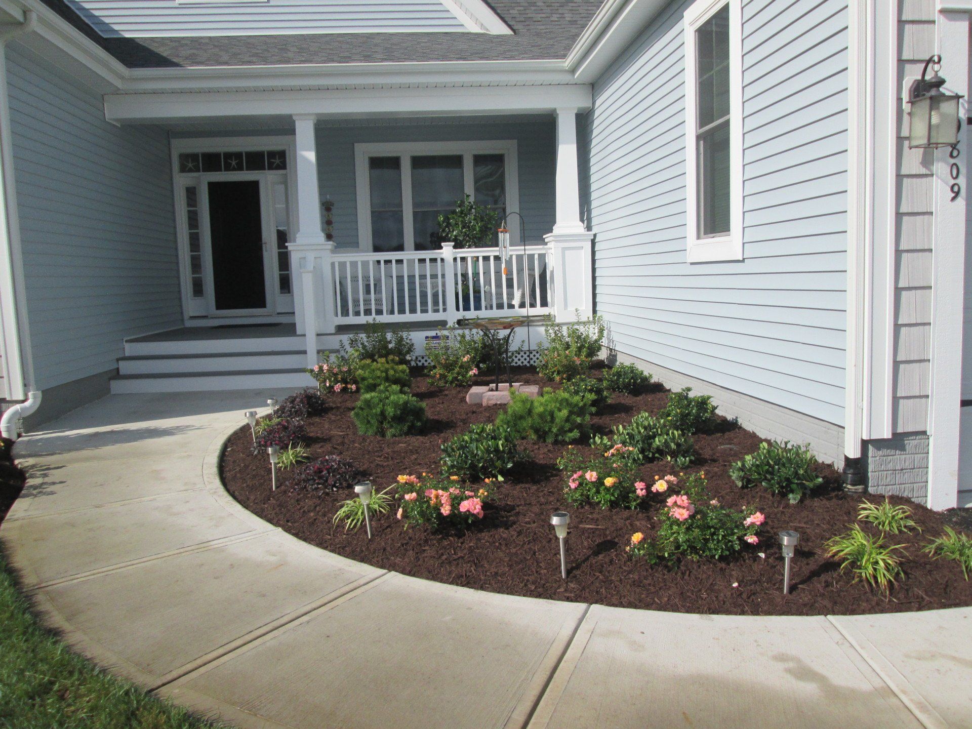A house with a circular walkway leading to the front door