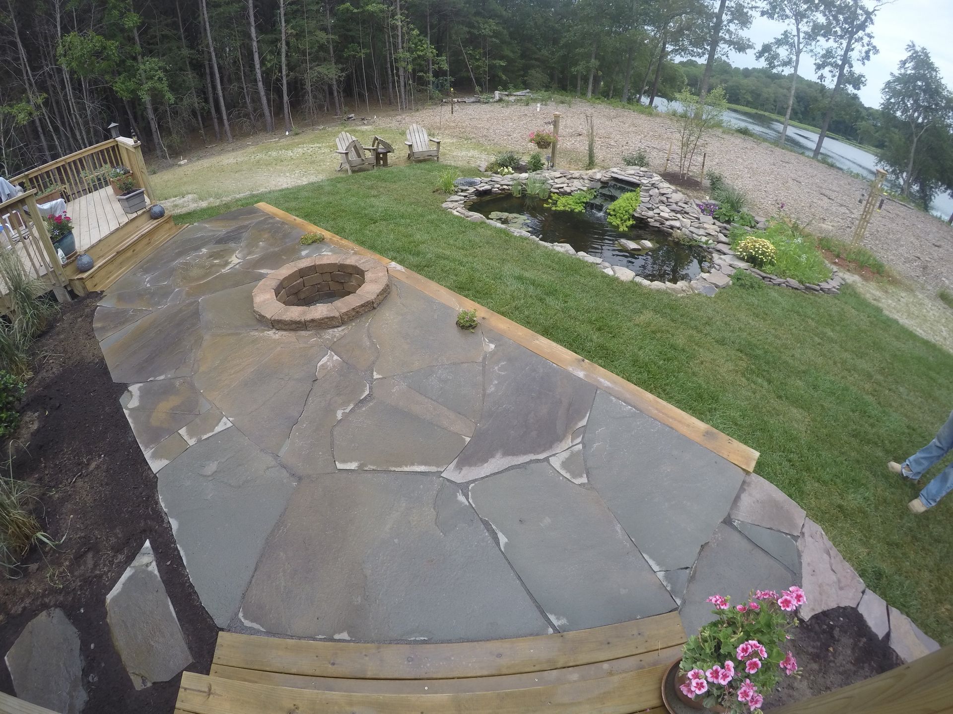 There is a fire pit in the middle of the backyard.